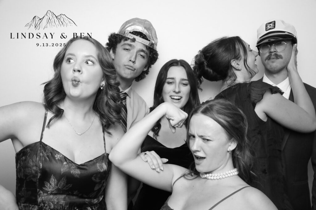 Couple celebrating in a wedding photo booth